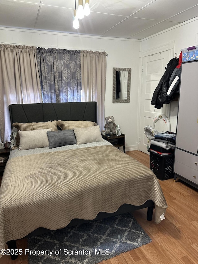 bedroom featuring wood finished floors