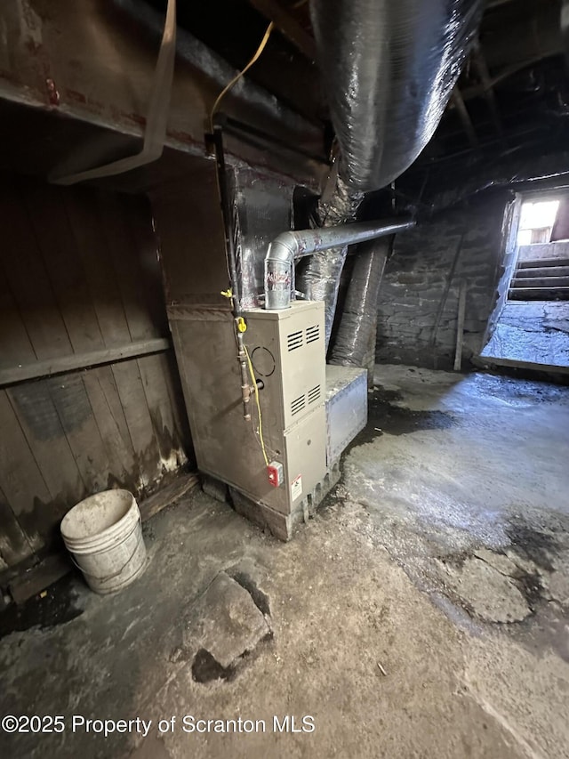 utility room with heating unit