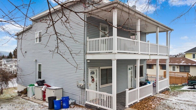 snow covered house with a balcony