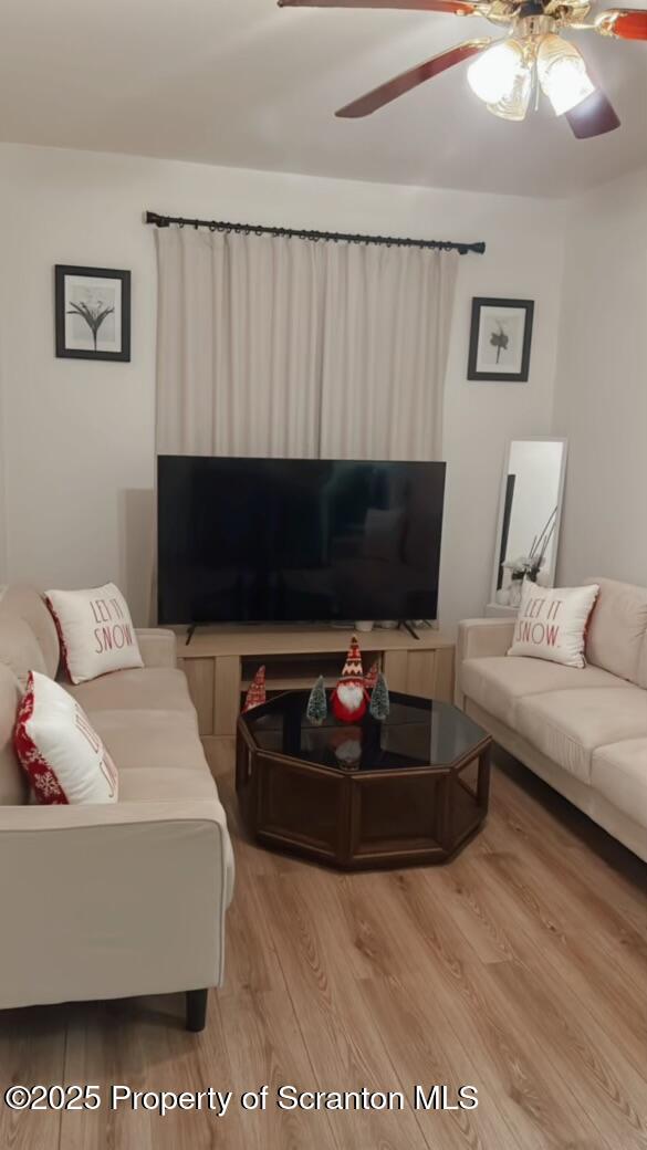 living room with light hardwood / wood-style floors