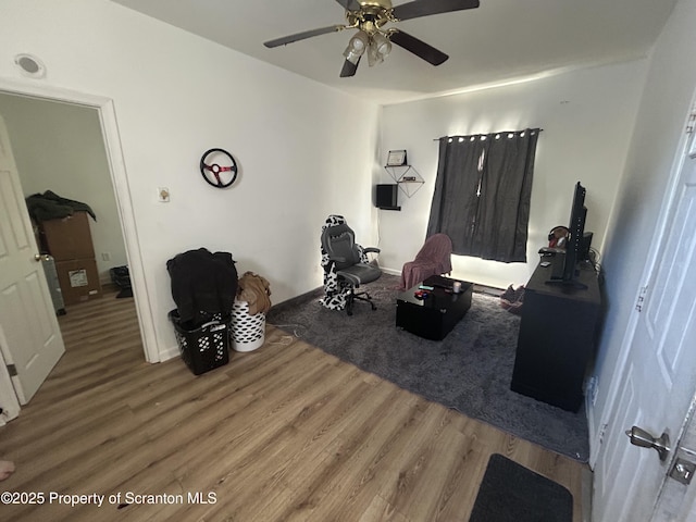 interior space featuring ceiling fan and hardwood / wood-style floors