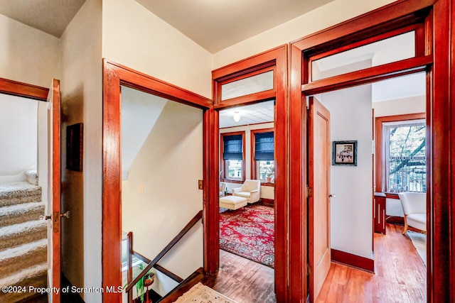 hall with light hardwood / wood-style flooring