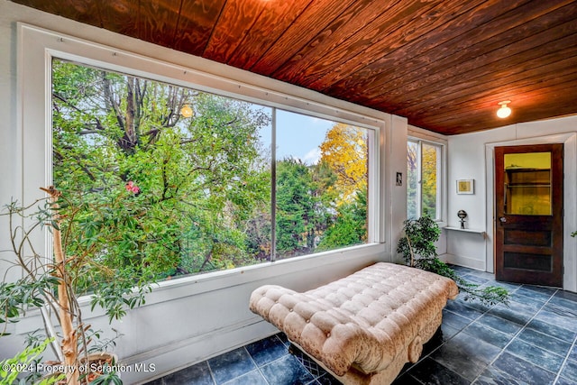 sunroom with wood ceiling and vaulted ceiling