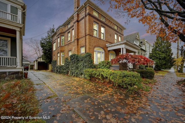 view of property exterior at dusk