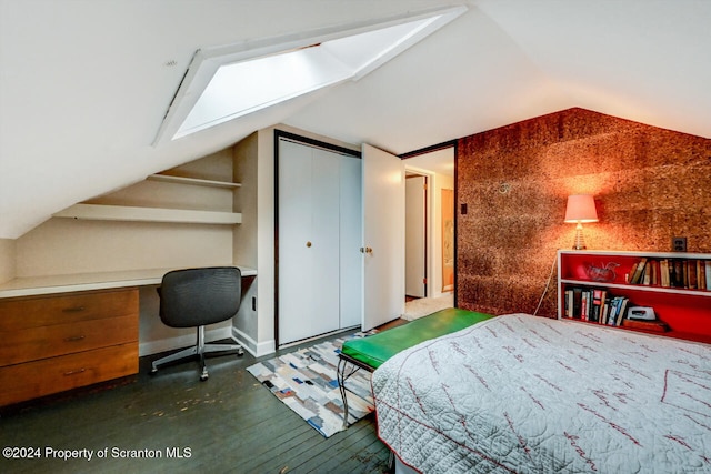 bedroom featuring lofted ceiling with skylight and a closet