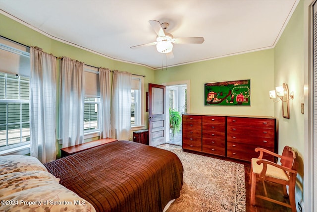 bedroom with access to exterior, ceiling fan, and ornamental molding