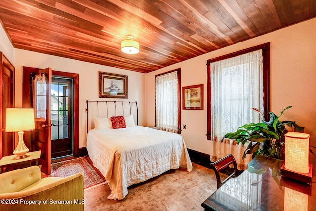 bedroom featuring multiple windows and wood ceiling