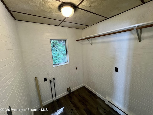 133-135 Newport St, Glen Lyon, PA 18617 - laundry room featuring dark wood-style flooring, a baseboard radiator, and electric dryer hookup