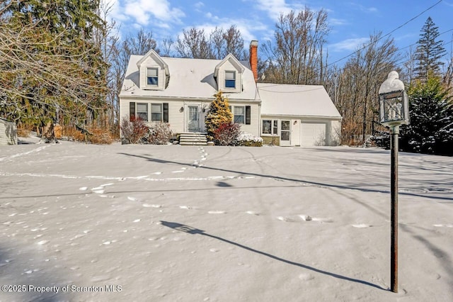 new england style home with a garage