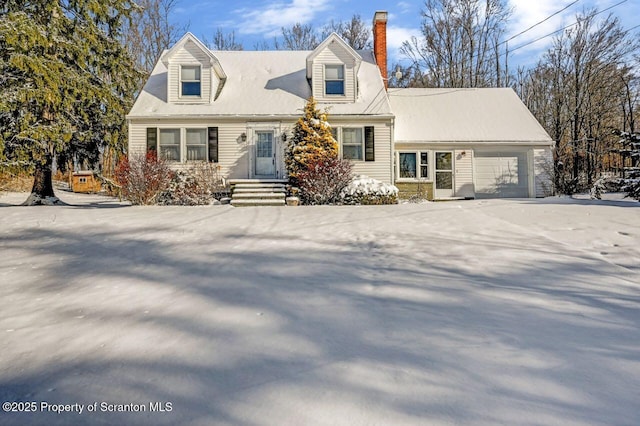 cape cod home with a garage