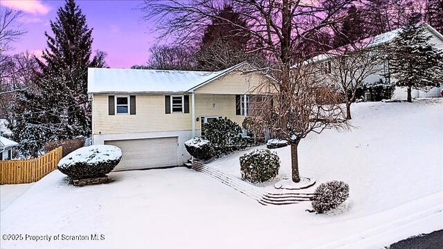 view of front of home with a garage