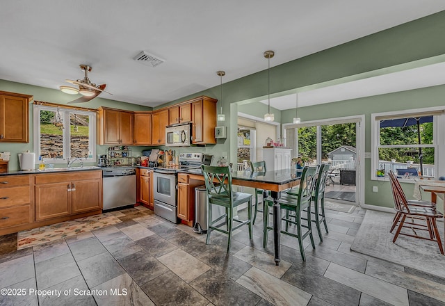 1017 Willow St Unit L14-15, Scranton, PA 18505 - kitchen with stainless steel appliances, dark countertops, and brown cabinets