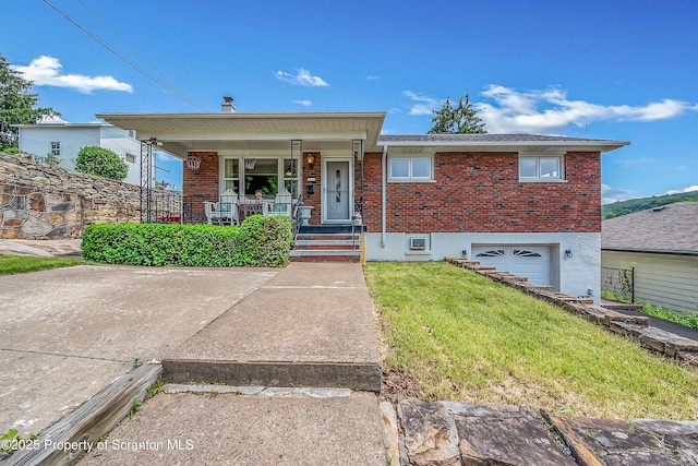 1017 Willow St Unit L14-15, Scranton, PA 18505 - view of front facade featuring a porch, brick siding, an attached garage, and a front lawn