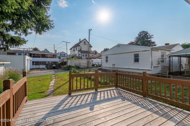 wooden deck with a yard