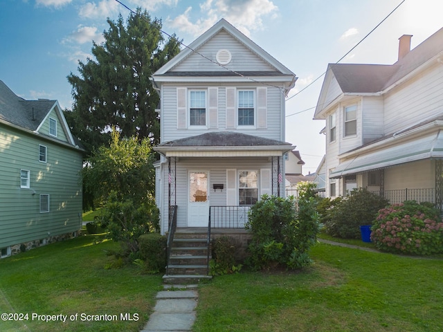 view of property with a porch and a front yard