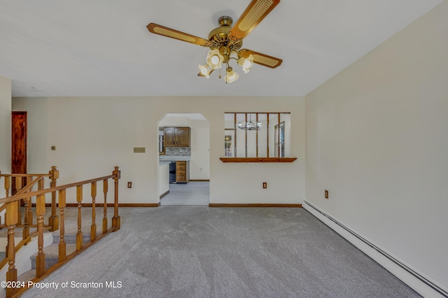 unfurnished room with ceiling fan, light colored carpet, and a baseboard radiator