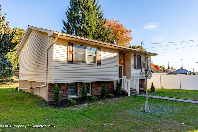 bi-level home with a front yard