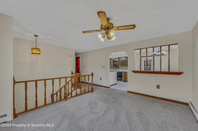 unfurnished room with ceiling fan, light carpet, and a baseboard radiator