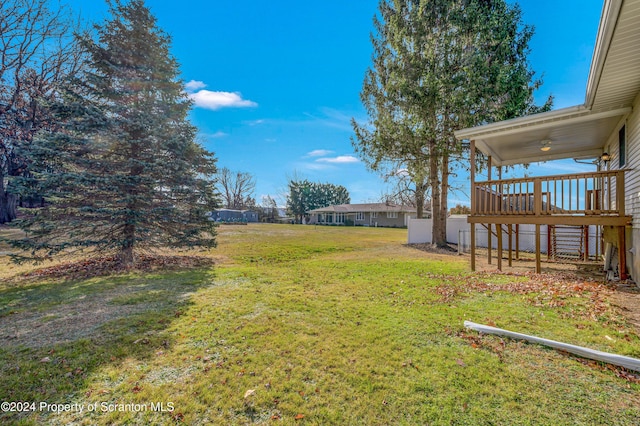 view of yard featuring a wooden deck