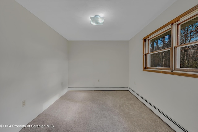 empty room featuring baseboard heating