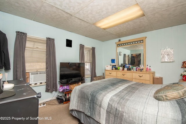 bedroom featuring cooling unit and carpet