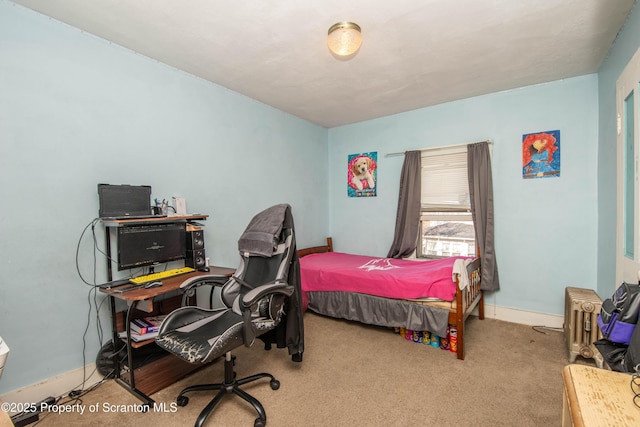 carpeted bedroom featuring baseboards