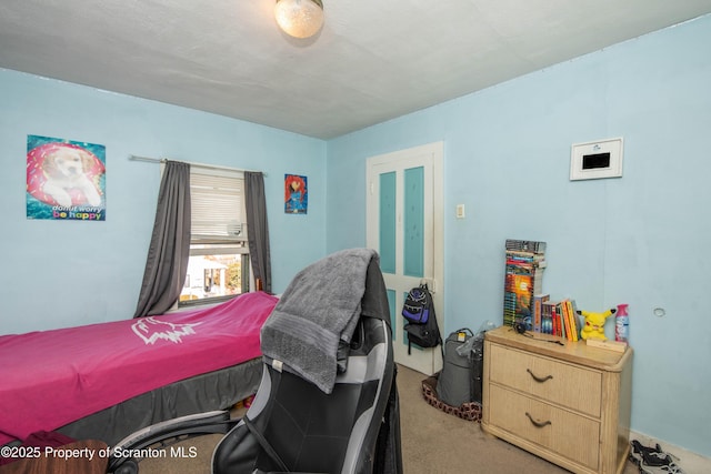 bedroom with light carpet