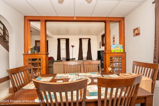 dining area featuring arched walkways