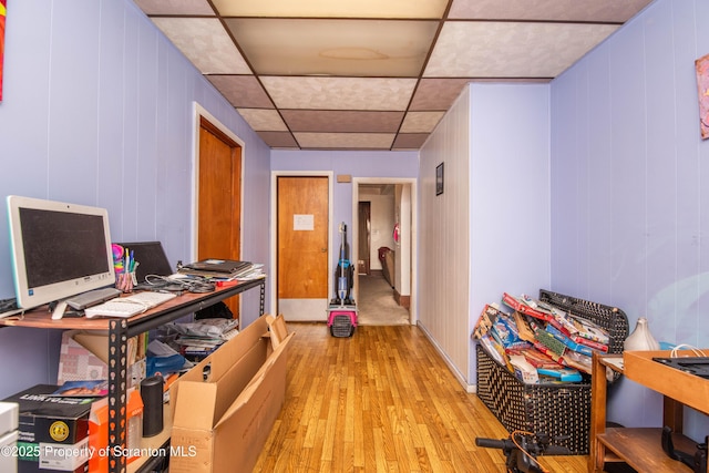 office with a paneled ceiling and light wood-style floors