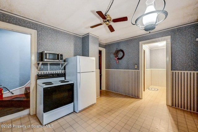 kitchen with white appliances, ornamental molding, and ceiling fan