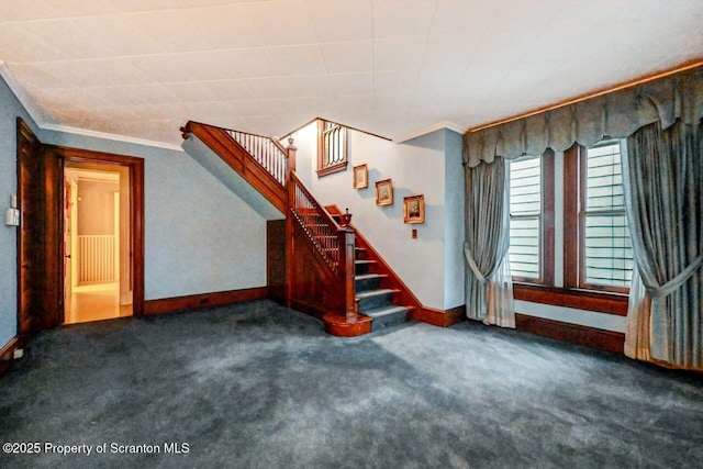 carpeted empty room with crown molding