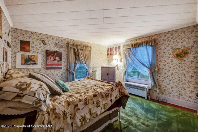 bedroom with carpet floors and radiator