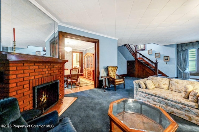 living room featuring crown molding, a fireplace, and carpet