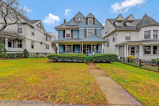 victorian-style house with covered porch and a front lawn