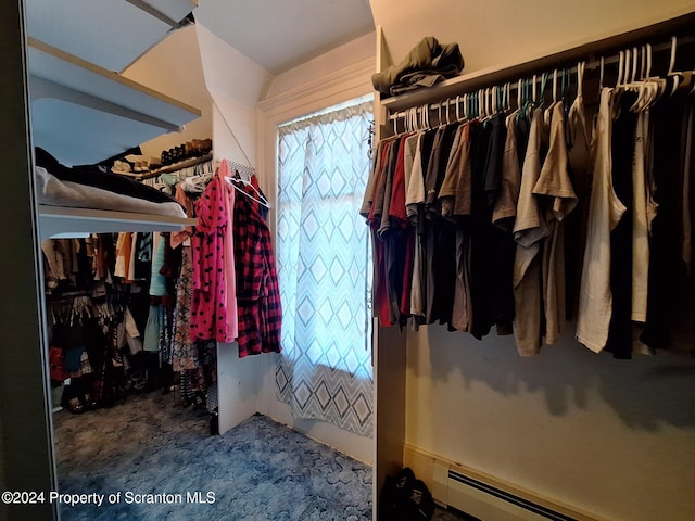 spacious closet with a baseboard radiator