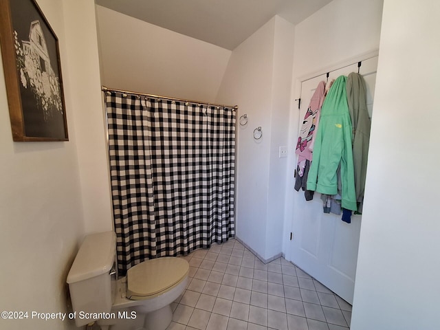 bathroom featuring tile patterned floors and toilet