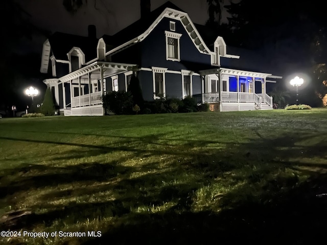 view of front of home with a yard