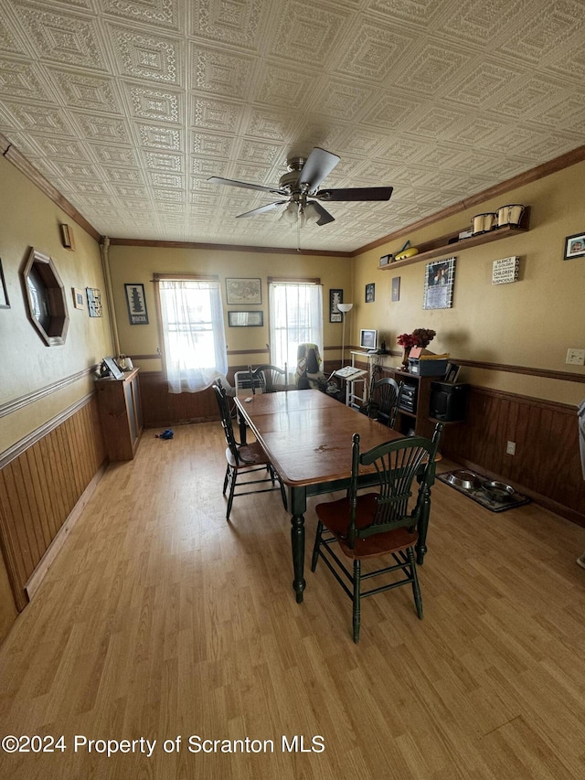 dining room with ceiling fan and wood-type flooring