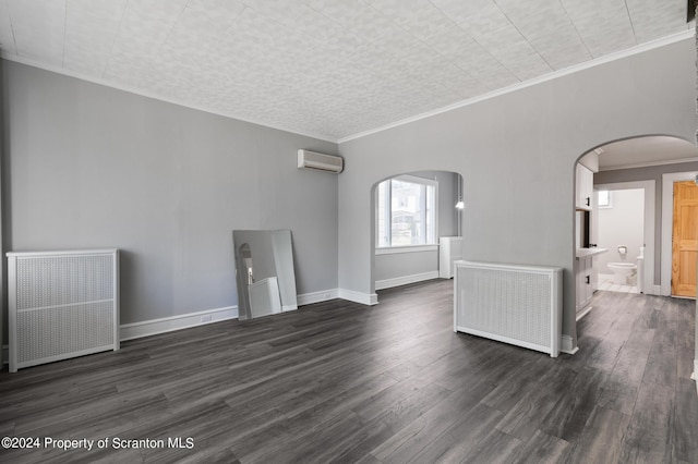 unfurnished living room with ornamental molding, radiator heating unit, dark wood-type flooring, and an AC wall unit