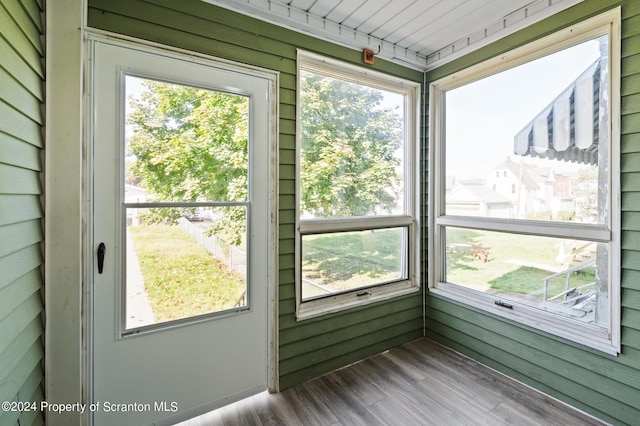 unfurnished sunroom with a healthy amount of sunlight