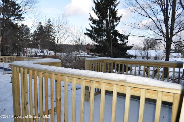 view of snow covered deck