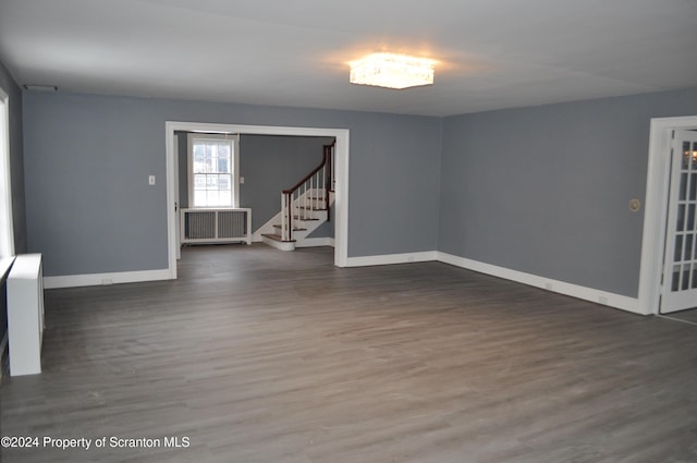 empty room featuring dark wood-type flooring