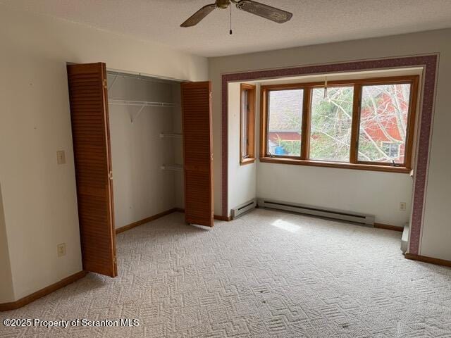 166 Tanglewod Dr, Greentown, PA 18426 - unfurnished bedroom with a baseboard heating unit, light colored carpet, a closet, and baseboards