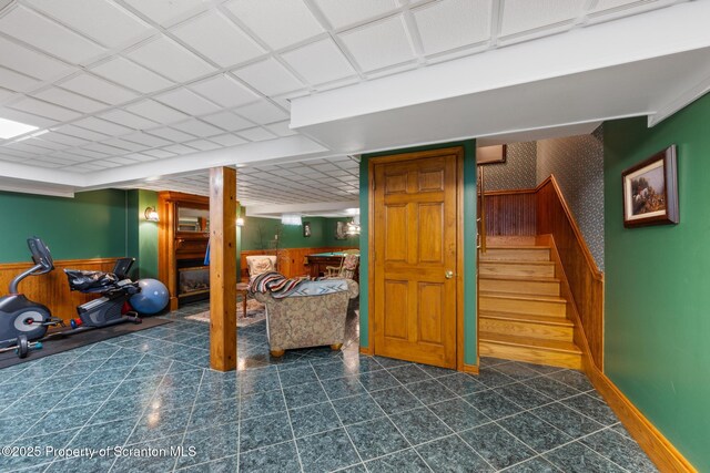 1200 Merion Cir, Clarks Summit, PA 18411 - finished below grade area featuring wallpapered walls, stairway, wainscoting, and wooden walls