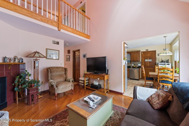 1200 Merion Cir, Clarks Summit, PA 18411 - living area with light wood finished floors and a towering ceiling