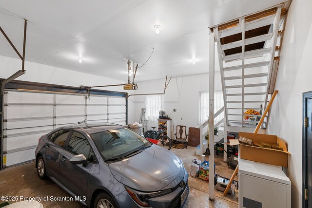 1200 Merion Cir, Clarks Summit, PA 18411 - garage featuring a garage door opener