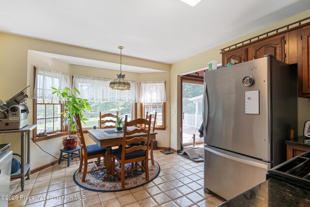 1200 Merion Cir, Clarks Summit, PA 18411 - dining room with healthy amount of natural light and light tile patterned flooring