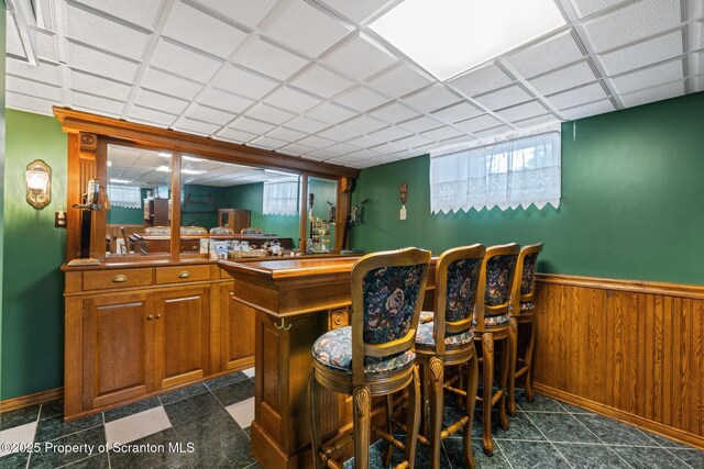 1200 Merion Cir, Clarks Summit, PA 18411 - indoor dry bar featuring a wainscoted wall and wooden walls