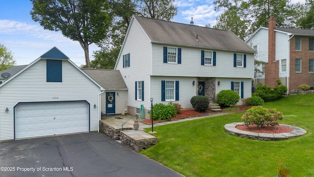 1200 Merion Cir, Clarks Summit, PA 18411 - colonial inspired home featuring driveway, a front yard, and a garage