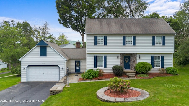 1200 Merion Cir, Clarks Summit, PA 18411 - colonial-style house featuring asphalt driveway, a front yard, an attached garage, and roof with shingles